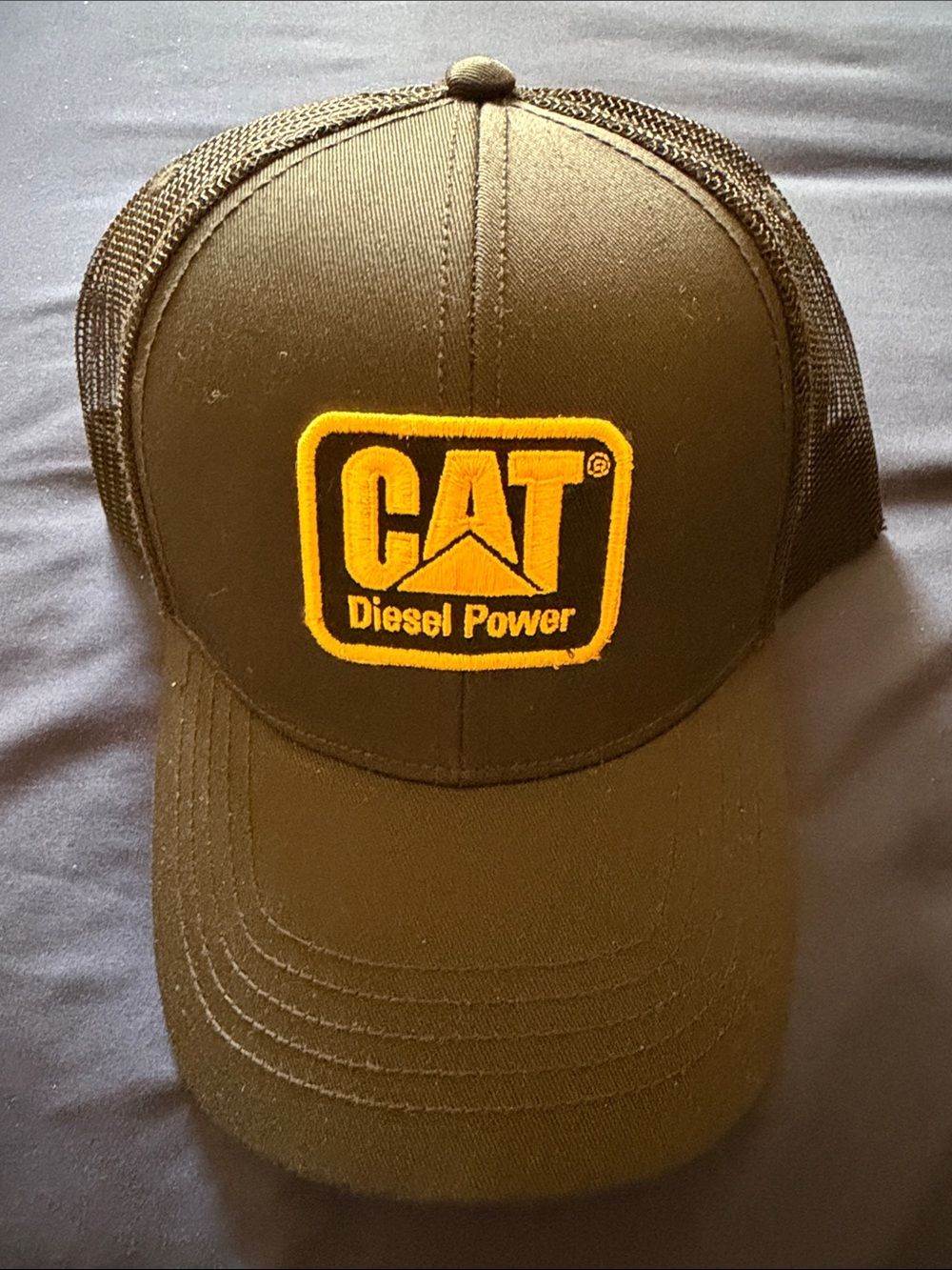 Caterpillar Black Trucker Cap with Yellow Logo